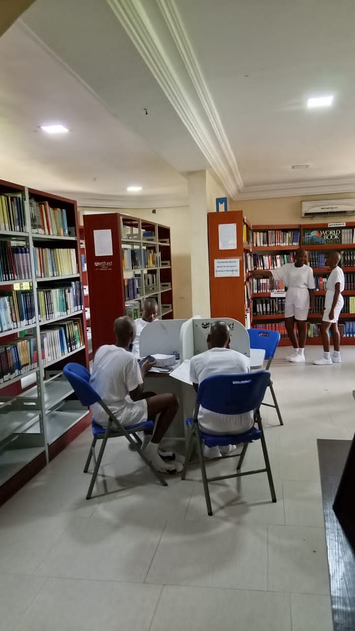 Students reading and studying in the library